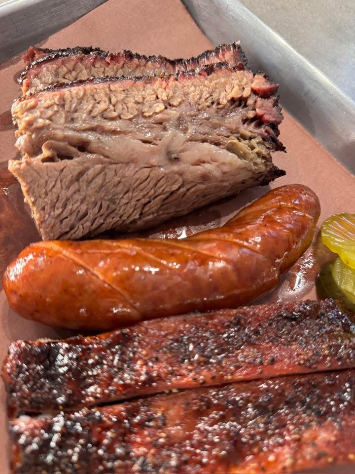 Sliced smoked brisket, jalapeño-cheddar sausage and pork ribs
