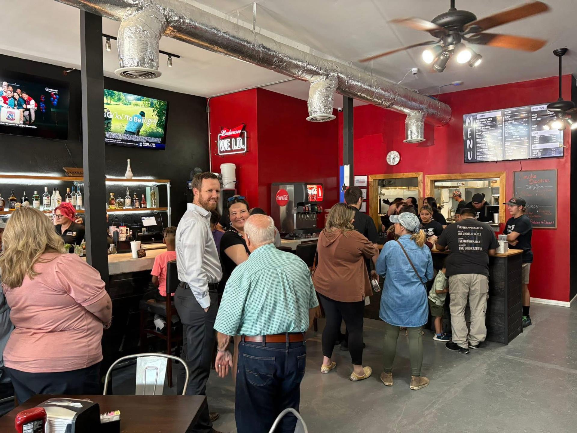 Busy dining room and order counter at Smoke Daddies